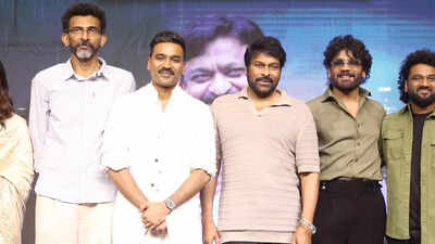 Dhanush shows respect to senior actors Nagarjuna and Chiranjeevi at 'Kuberaa' event.