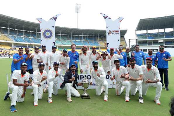 The victorious Vidarbha team pose with the trophy